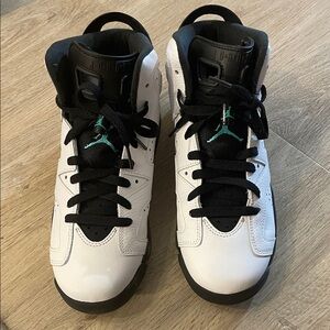 Jordan Kids. 6. White and Black Sneakers with Teal Accents